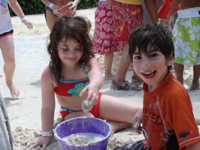 Child with cerebral palsy on vacation on Disney's Castaway Cay with his sister