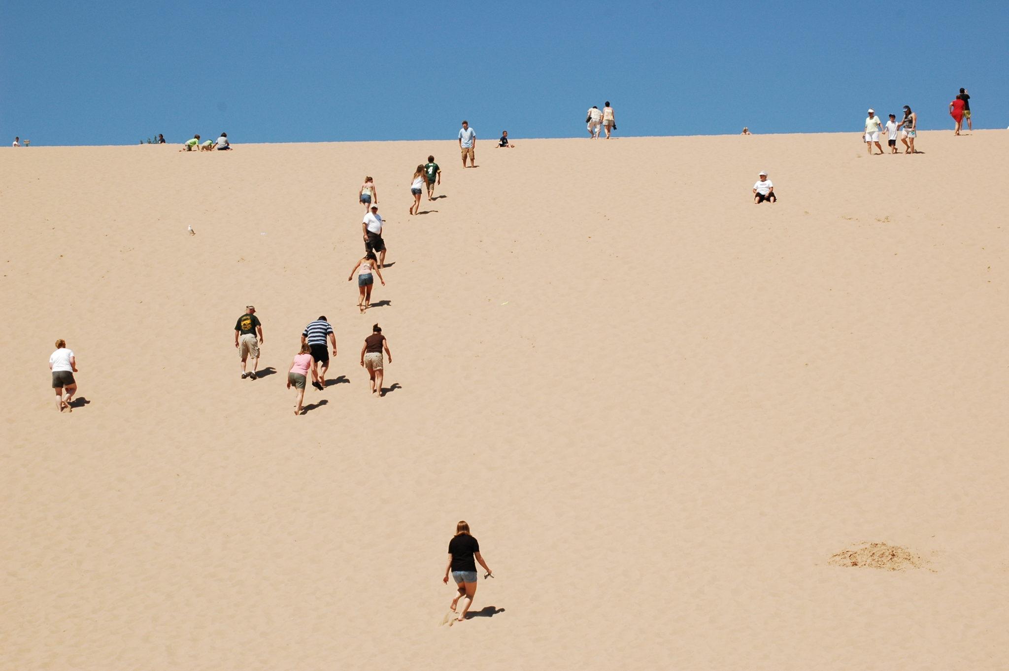 Climbing the Sleeping Bear Dunes is fun for all ages (Photo courtesy of Traverse City Convention & Visitors Bureau)