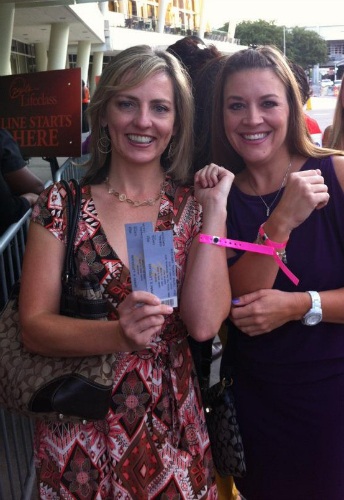 Showing off our pink VIP wristbands at Oprah's Life Class