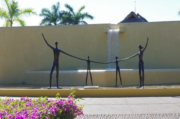 Sculpture of family holding hands at Four Seasons Punta Mita