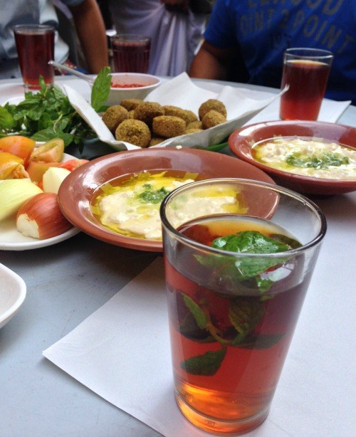 Jordanian lunch of hummus, falafel, baba ganouj and addictive mint tea (Photo credit: Claudia Laroye)