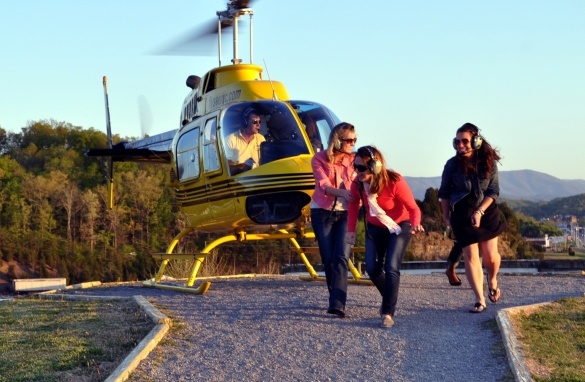 Ducking and laughing after our helicopter ride in Sevierville