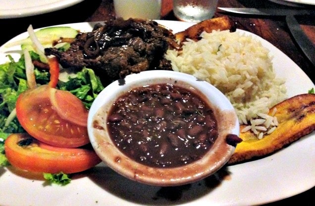 Traditional Costa Rican specialties: beef, fried plantain, gallo pinto (Photo credit: Claudia Laroye)