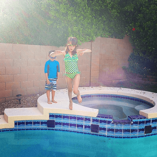 My kids jumping into our backyard pool in Scottsdale, Arizona (Photo credit: Colleen Lanin)