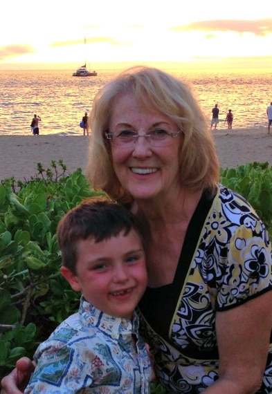 Grandson and grandma posing in front of yet another beautiful sunset at Sheraton Maui