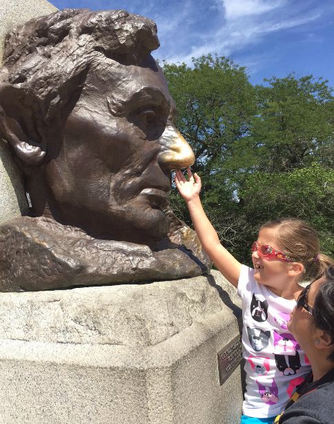 Rubbing Lincoln's nose in Springfield, Illinois with kids