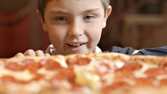 My son drooling over a Red Banjo pizza in Park City 