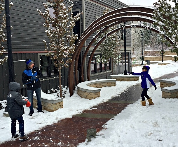 A family snowball fight along Park City's Main Street ~ What to Do in Park City Beyond the Slopes