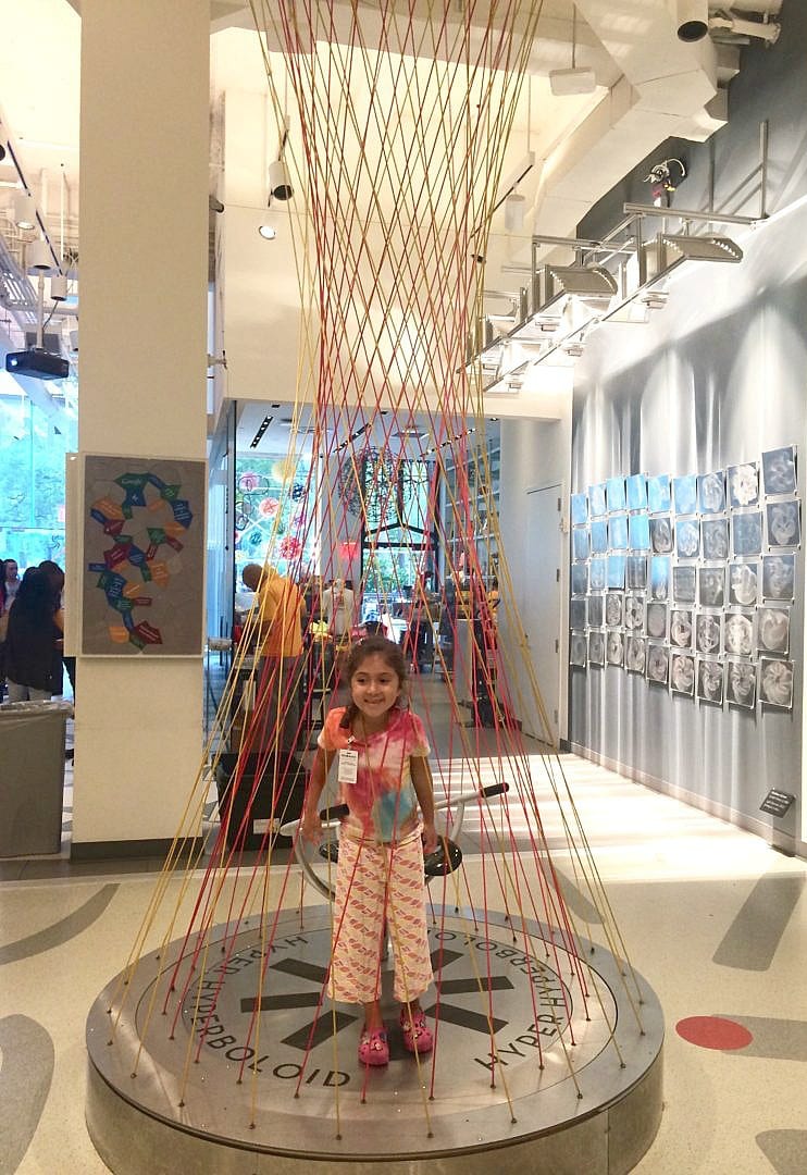 The Hyper Hyperboloid chair is a favorite with kids and grown ups alike at MoMath Museum in New York City