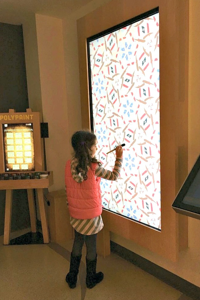 The Polypaint exhibit lets kids "paint" on a digital canvas at MoMath Museum in New York City