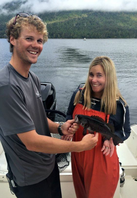 So proud of my wee rockfish catch, with thanks to guide Joel for helping to reel it in. (Photo credit: Claudia Laroye)