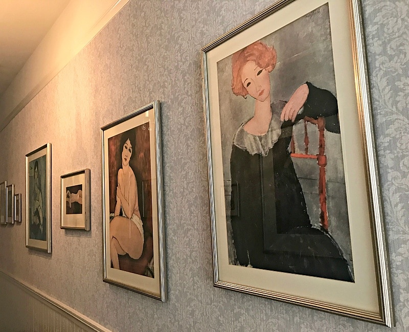 Prints by Amedeo Madigliani adorn the walls of one floor of Cornell Hotel de France