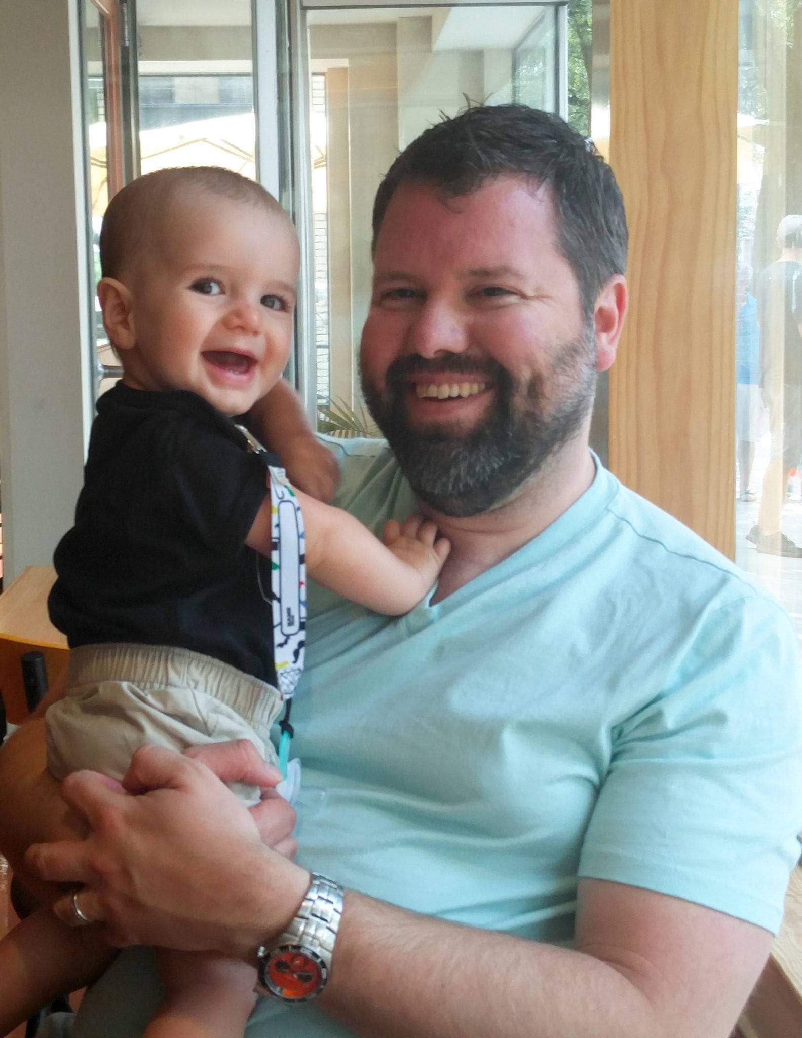 Daddy and baby chilling out at Newgrass Brewing ~ 10 Tips for Visiting a Brewery with Kids