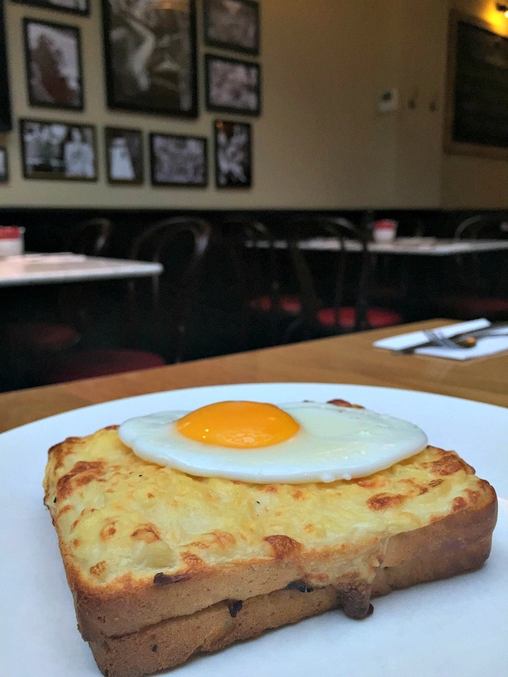 A croque madame is served with a fried egg on top ~ Best Grilled Cheese Sandwiches Around the World