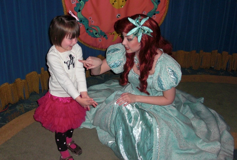 Child meeting Ariel at a Disneyland character dining meal