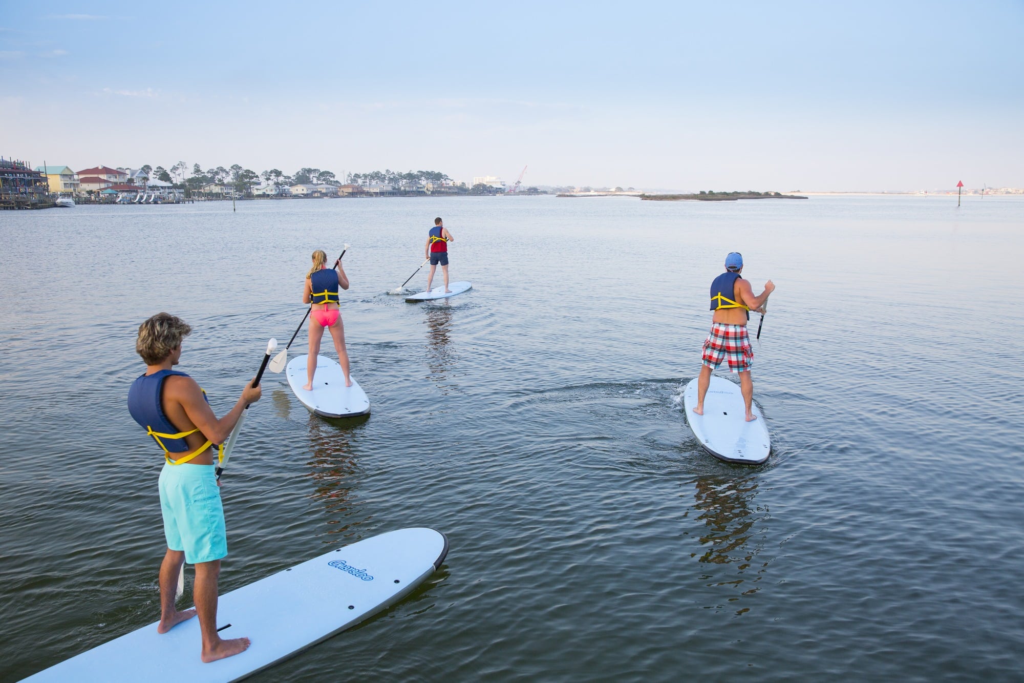 Stand up paddle boarding is a fun way to explore Gulf Shores with kids (