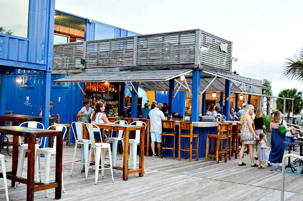 Dining al fresco among the shipping containers at The Gulf in Gulf Shores with kids