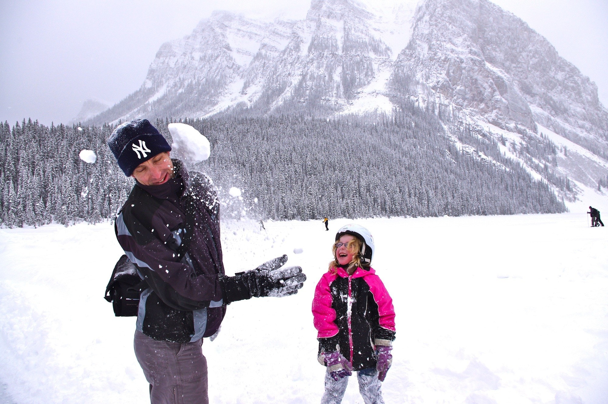 Family snowball fight at Lake Louise, Alberta ~ 25 Places in Canada Every Family Should Visit