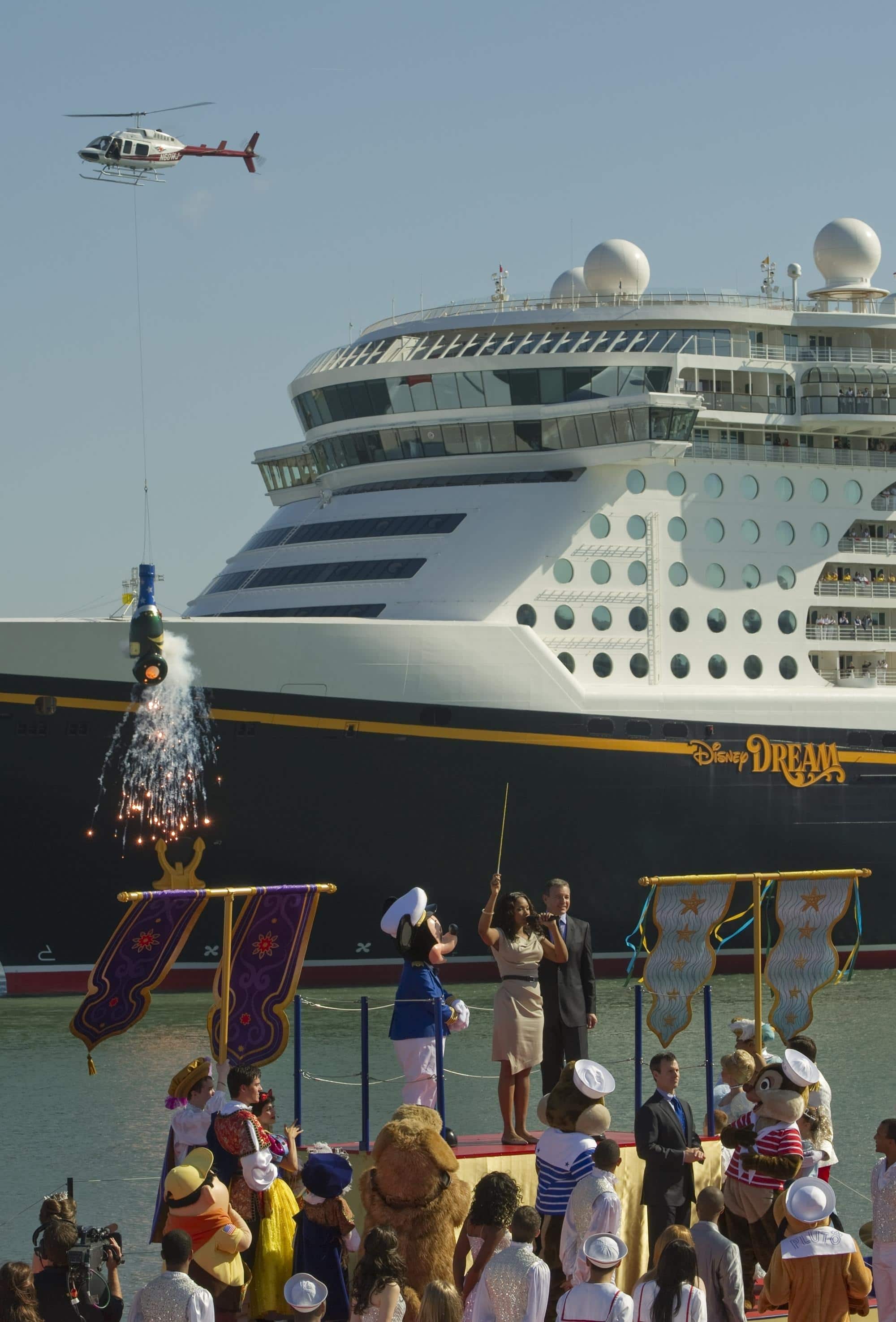 Helicopter toting a gigantic Champagne bottle "filled with dreams" at Disney Dream christening ceremony