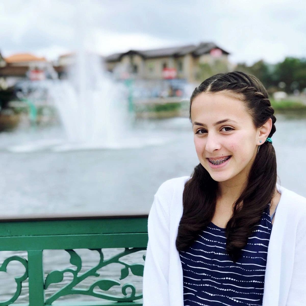 A tween posing at Disney Springs ~ Disney World with Teens & Tweens