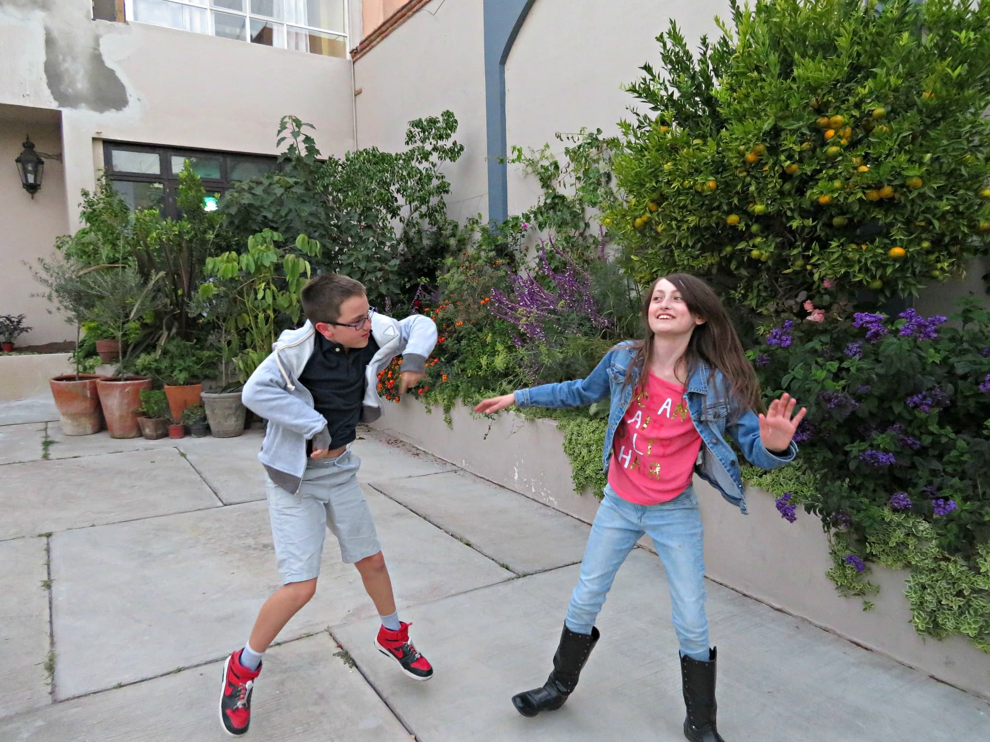 My kids doing a happy dance outside our San Miguel de Allende vacation rental