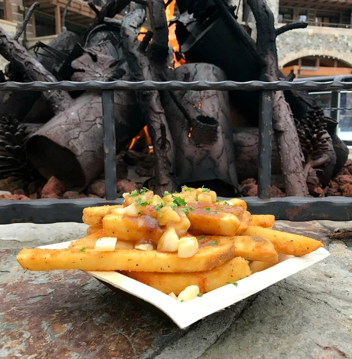 Poutine makes a tasty apres ski treat from the Frites stand in the Village at Northstar with kids