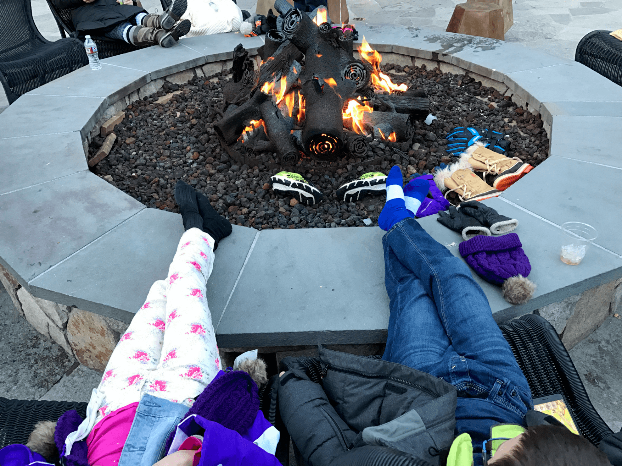 Warming up by the fire at Marshmology at Northstar California with kids