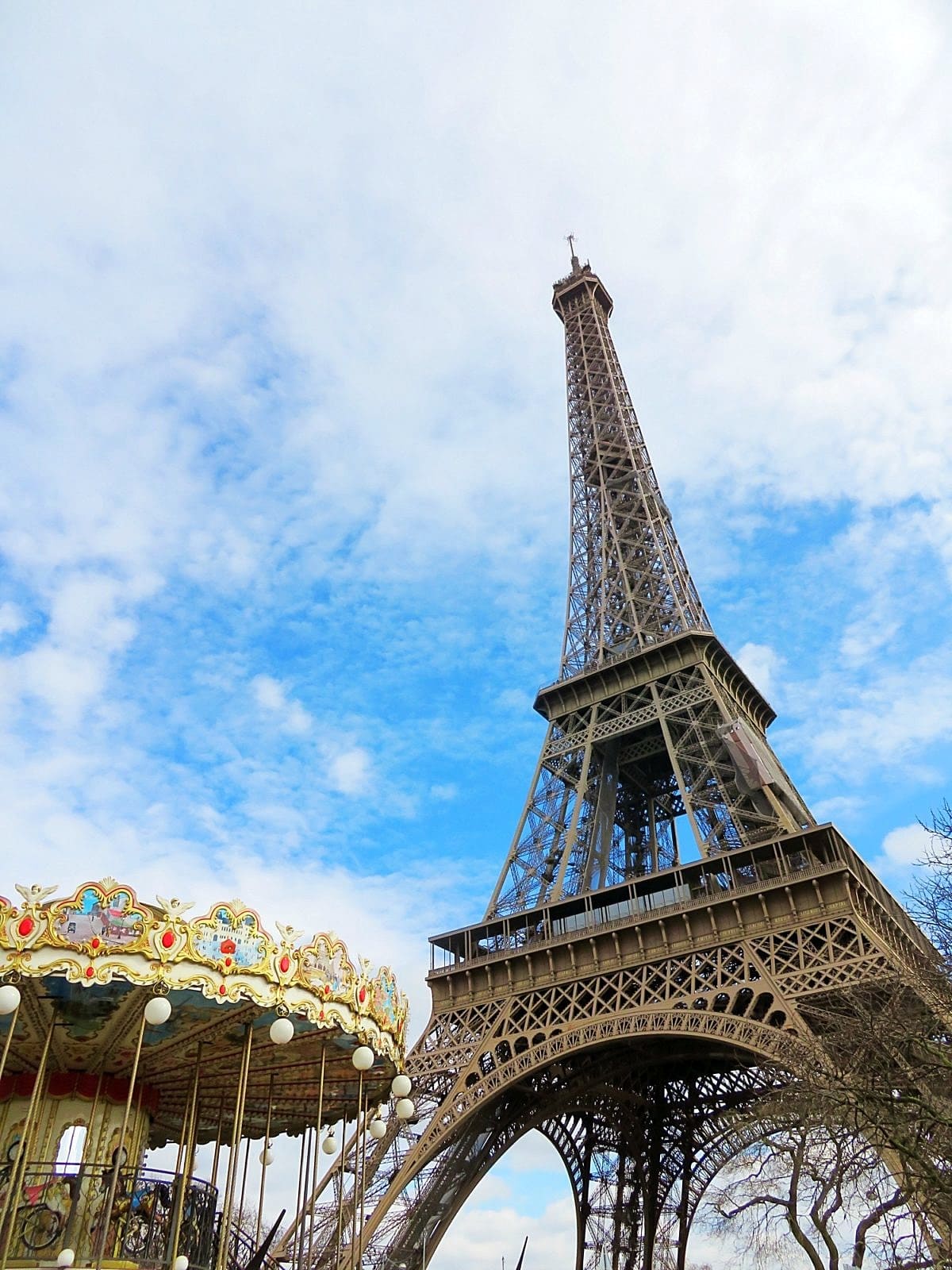 Eiffel Tower and carousel in Paris with kids