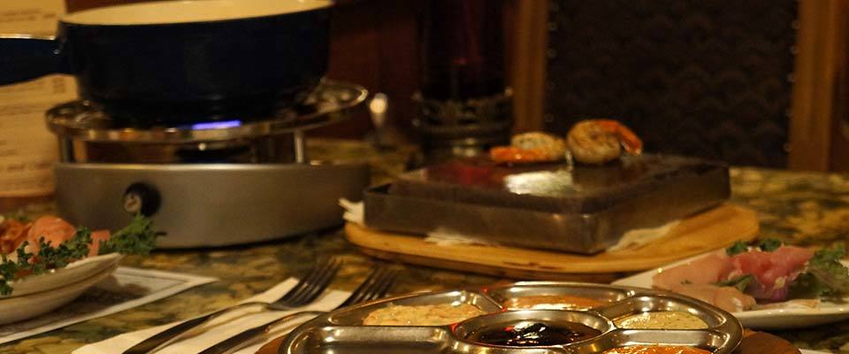 A fondue dinner at Grizzly House make a memorable meal in Banff with kids