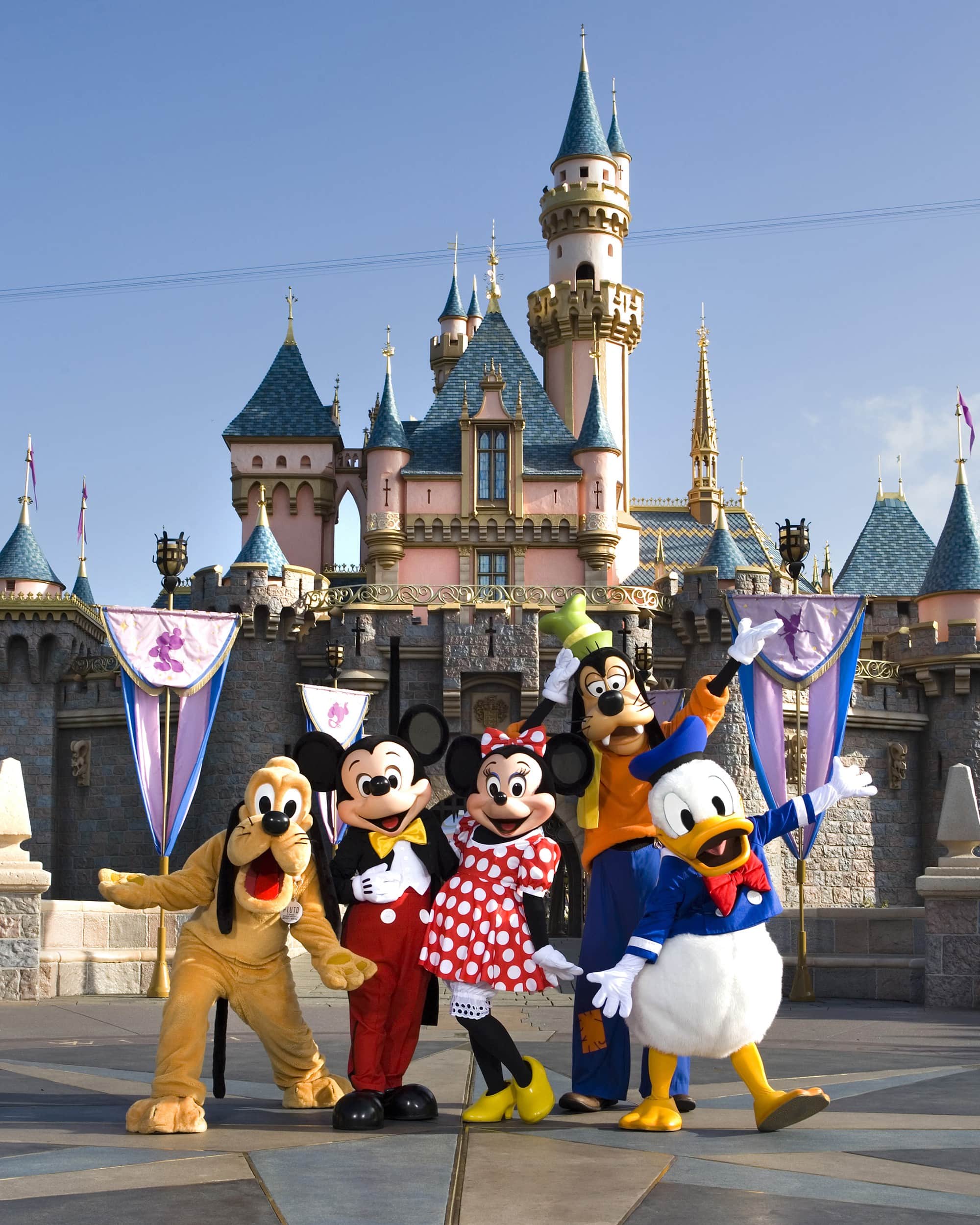 Mickey Mouse and friends in front of Sleeping Beauty's Castle at Disneyland