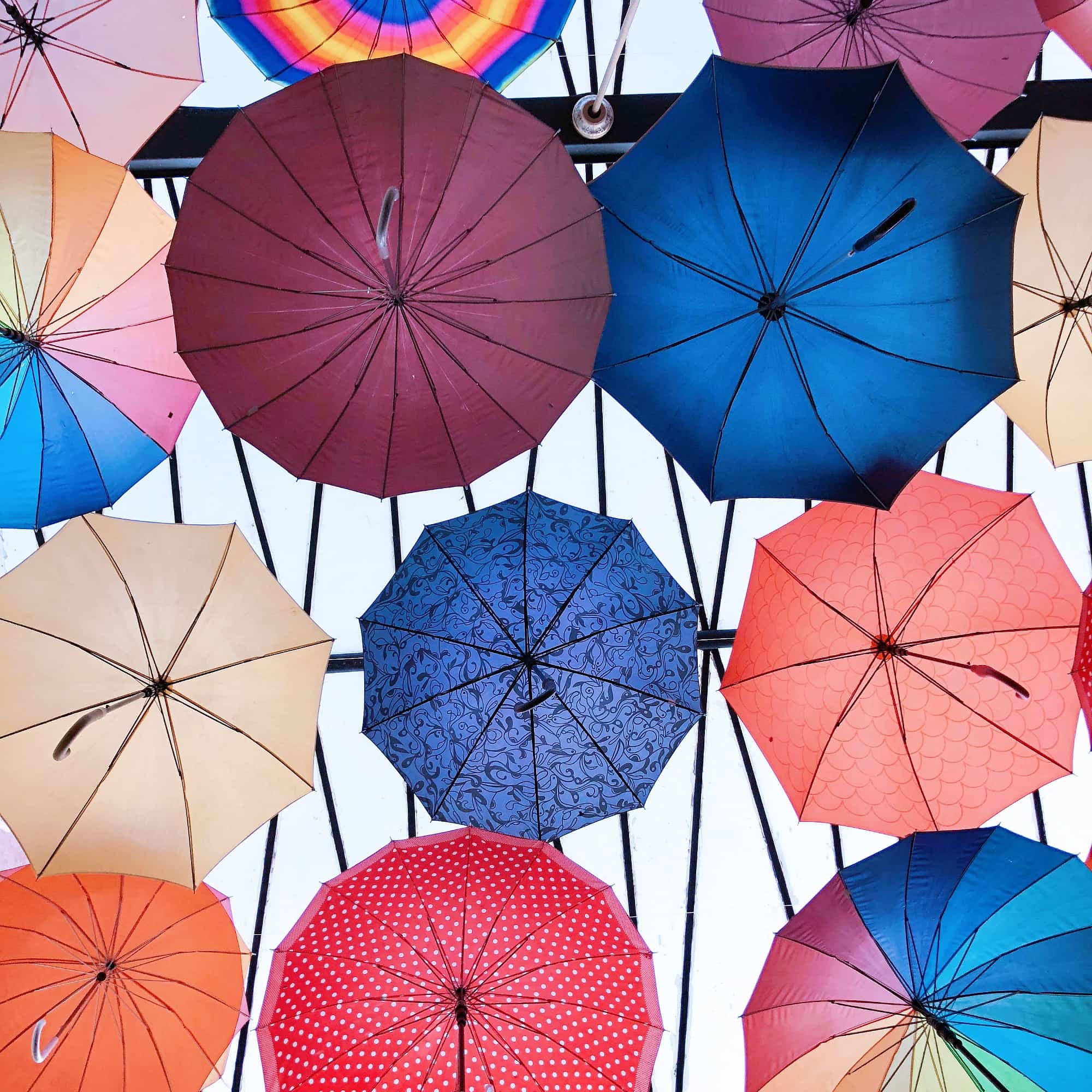 Bright umbrellas line the covered patio at Vivali Italian restaurant in San Miguel de Allende