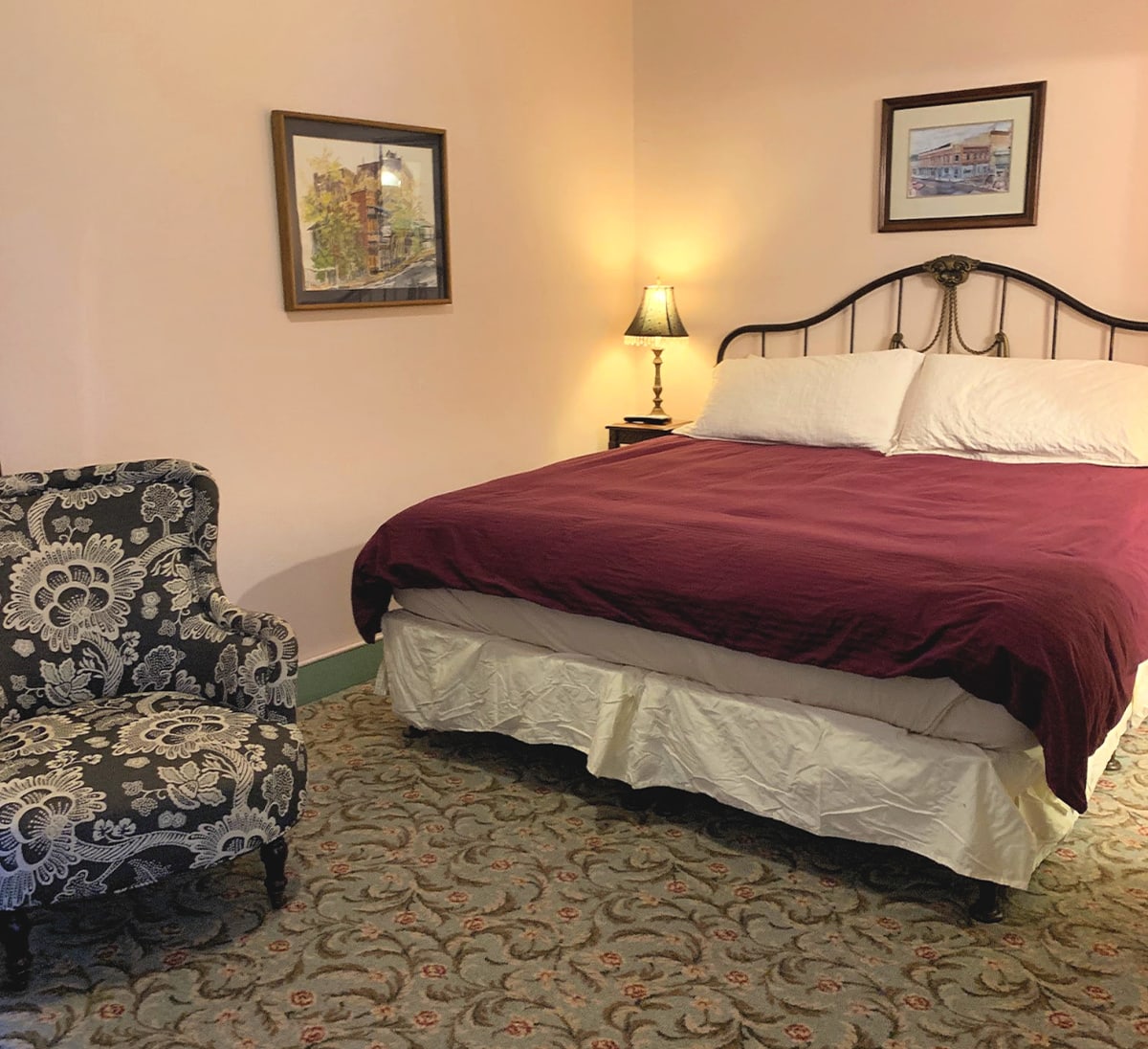 The king bed in the bedroom portion of our Room 2 suite at the Connor Hotel 