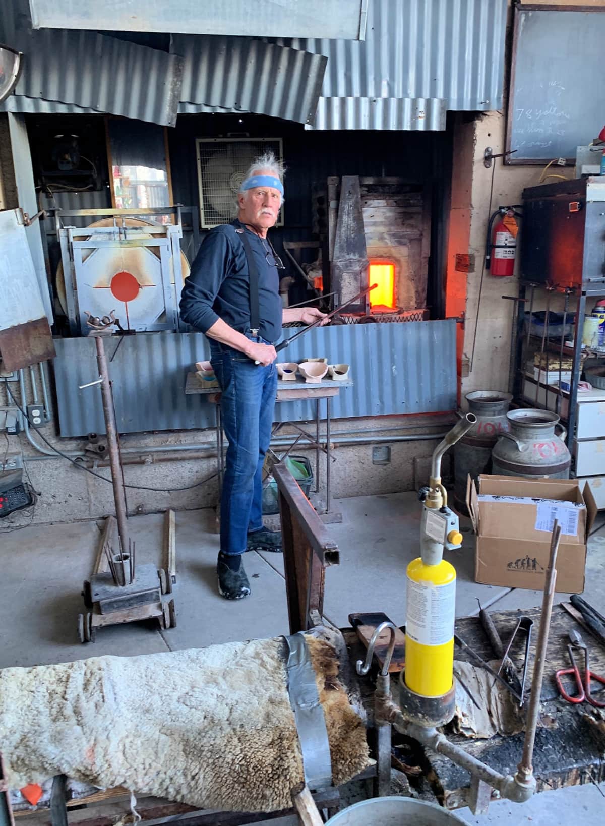 Artist Tracy Weisel gives demonstrations at his La Victoria Glass Blowing Studio in Jerome, Arizona