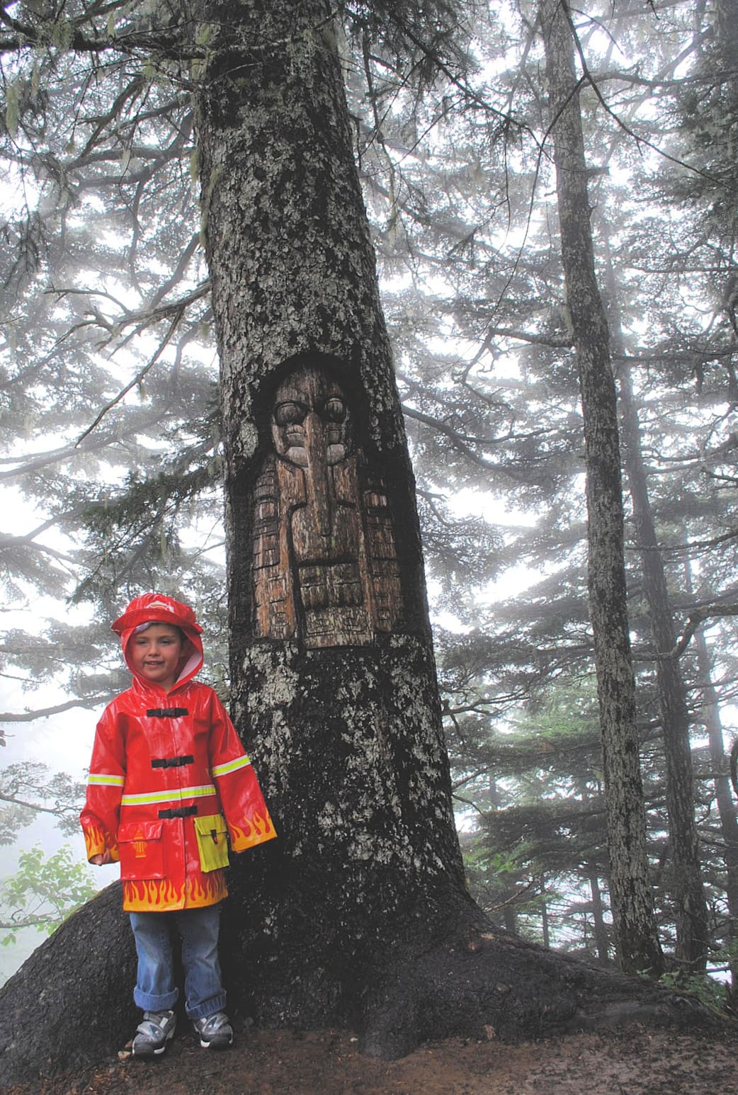 A living tree carving on Mount Roberts in Juneau, Alaska with kids