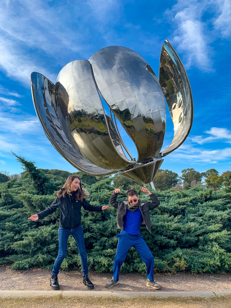 Kids dancing in front of Floralis Generica in Buenos Aires