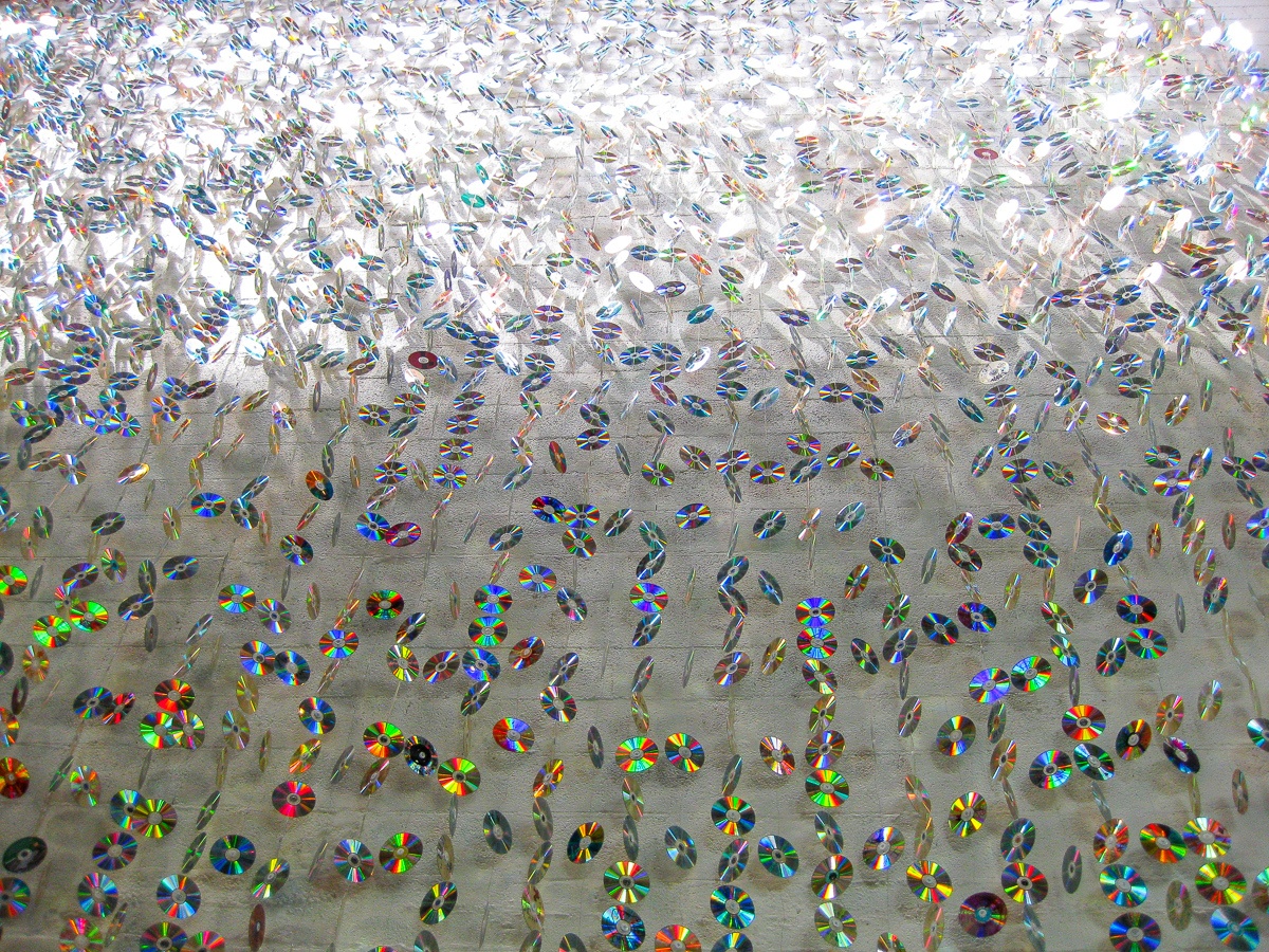 An art installation that embodies reduce, reuse, recycle made with old CDs at Phoenix Children's Museum