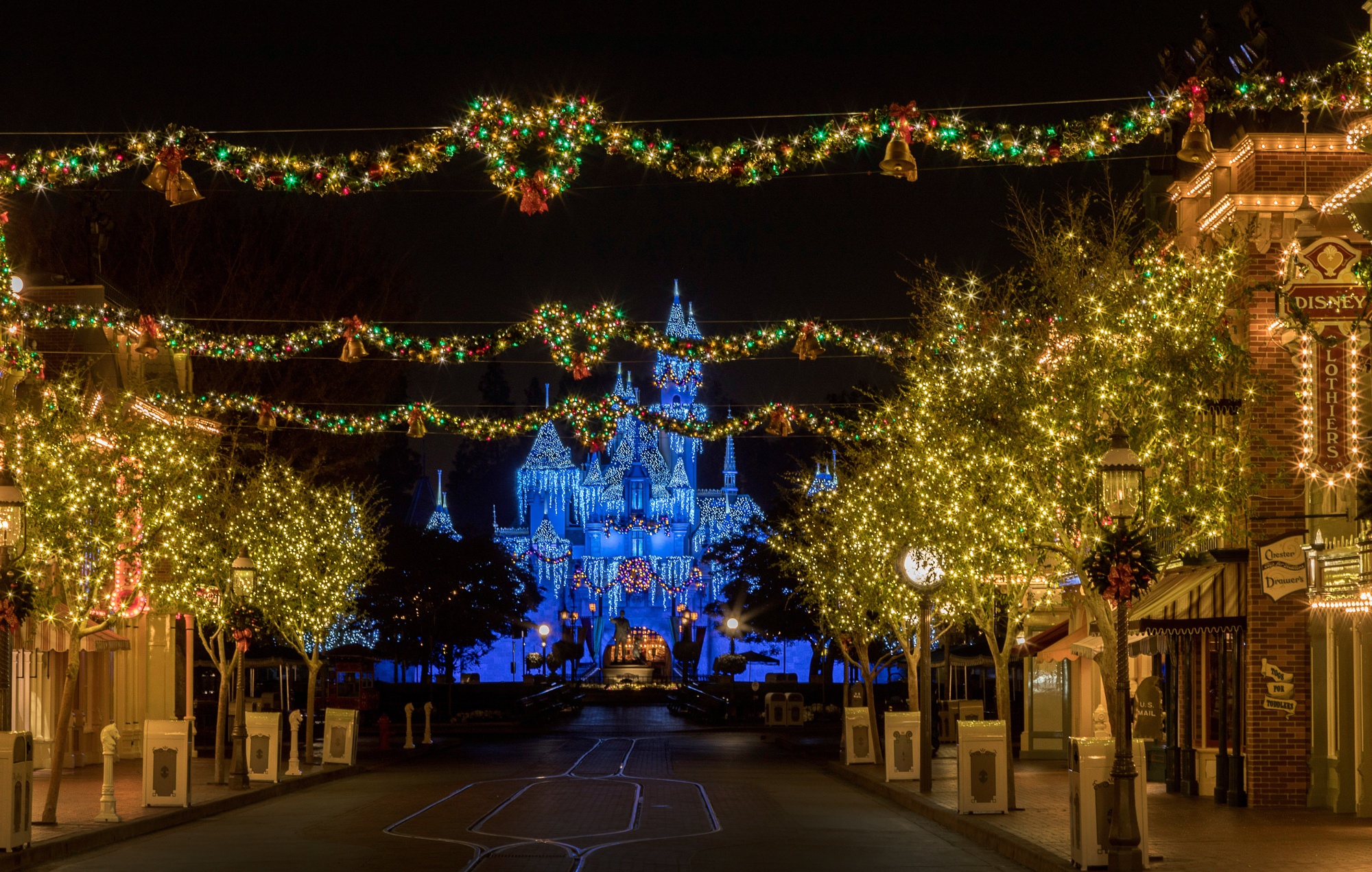 Disneyland holiday decorations on Main Street and Sleeping Beauty Castle