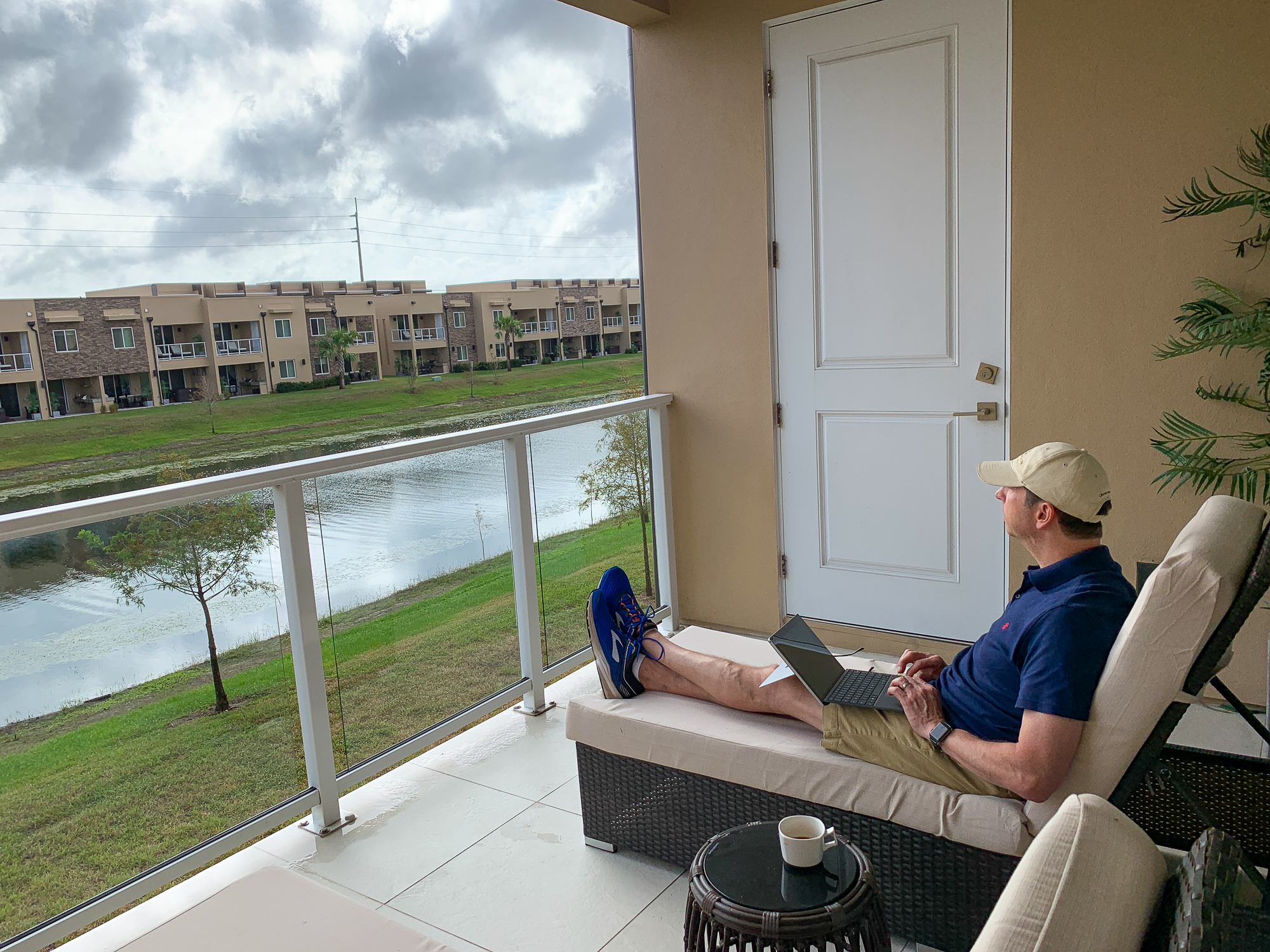 My husband relaxing on the balcony at our Magic Village vacation home