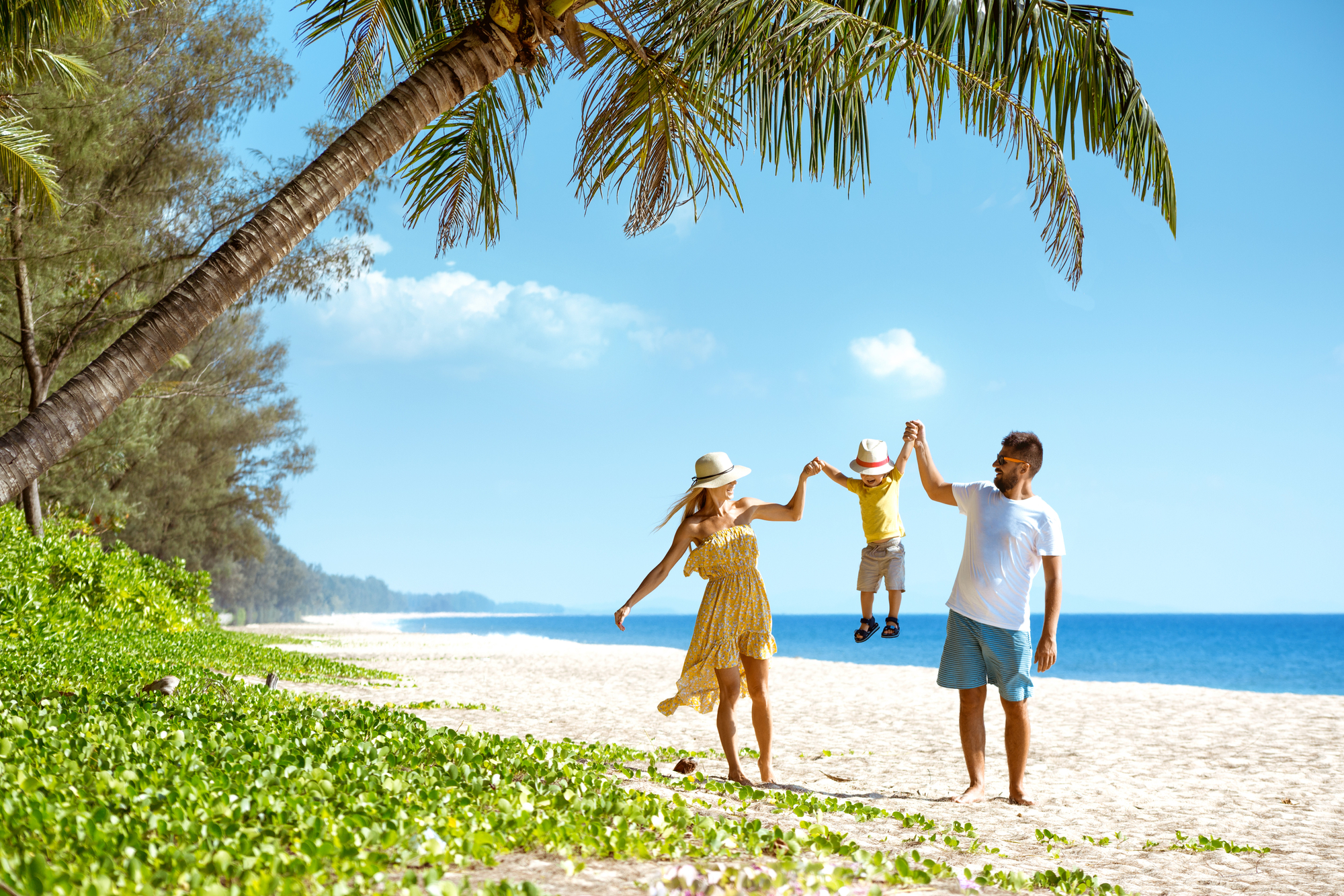 Couple with toddler on beach