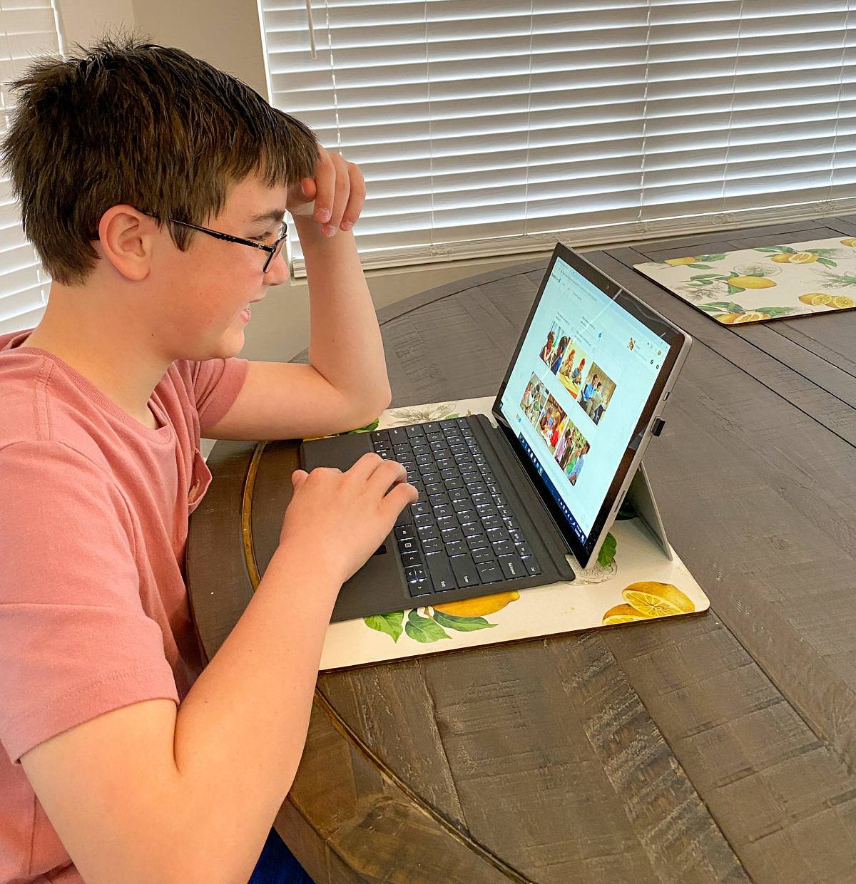 tween practicing his Spanish skills at home with Rosetta Stone