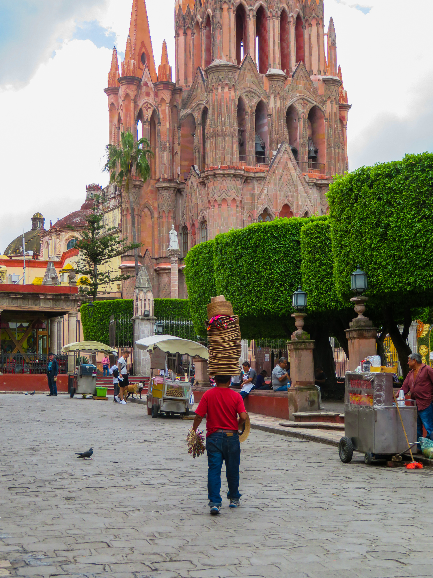 A hat vendor in San Miguel de Allende's central square