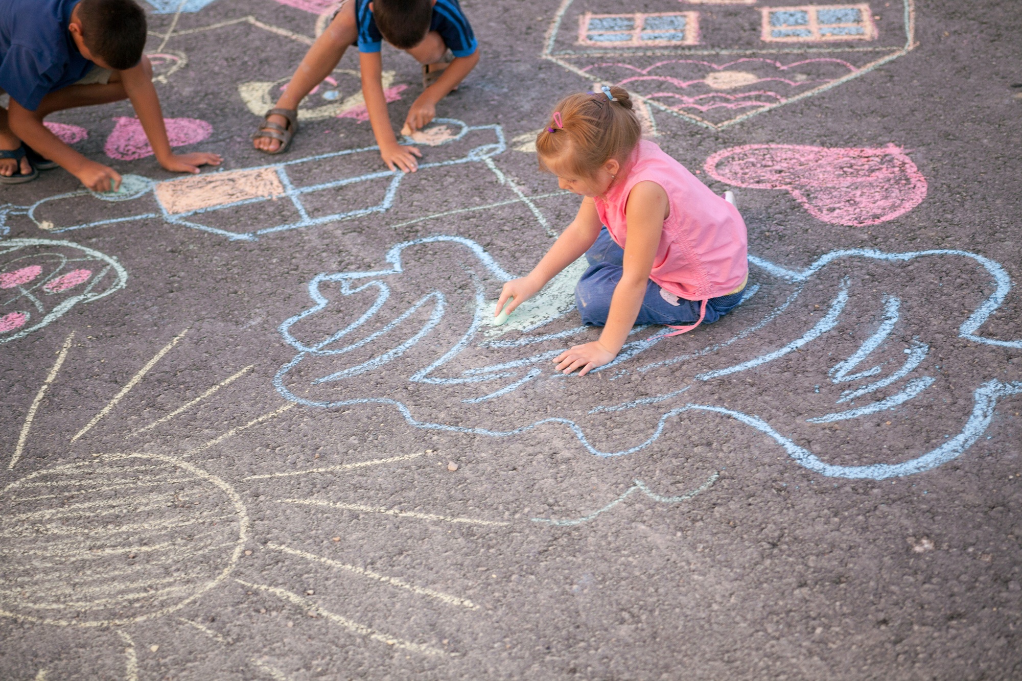 Children love drawing with sidewalk chalk 