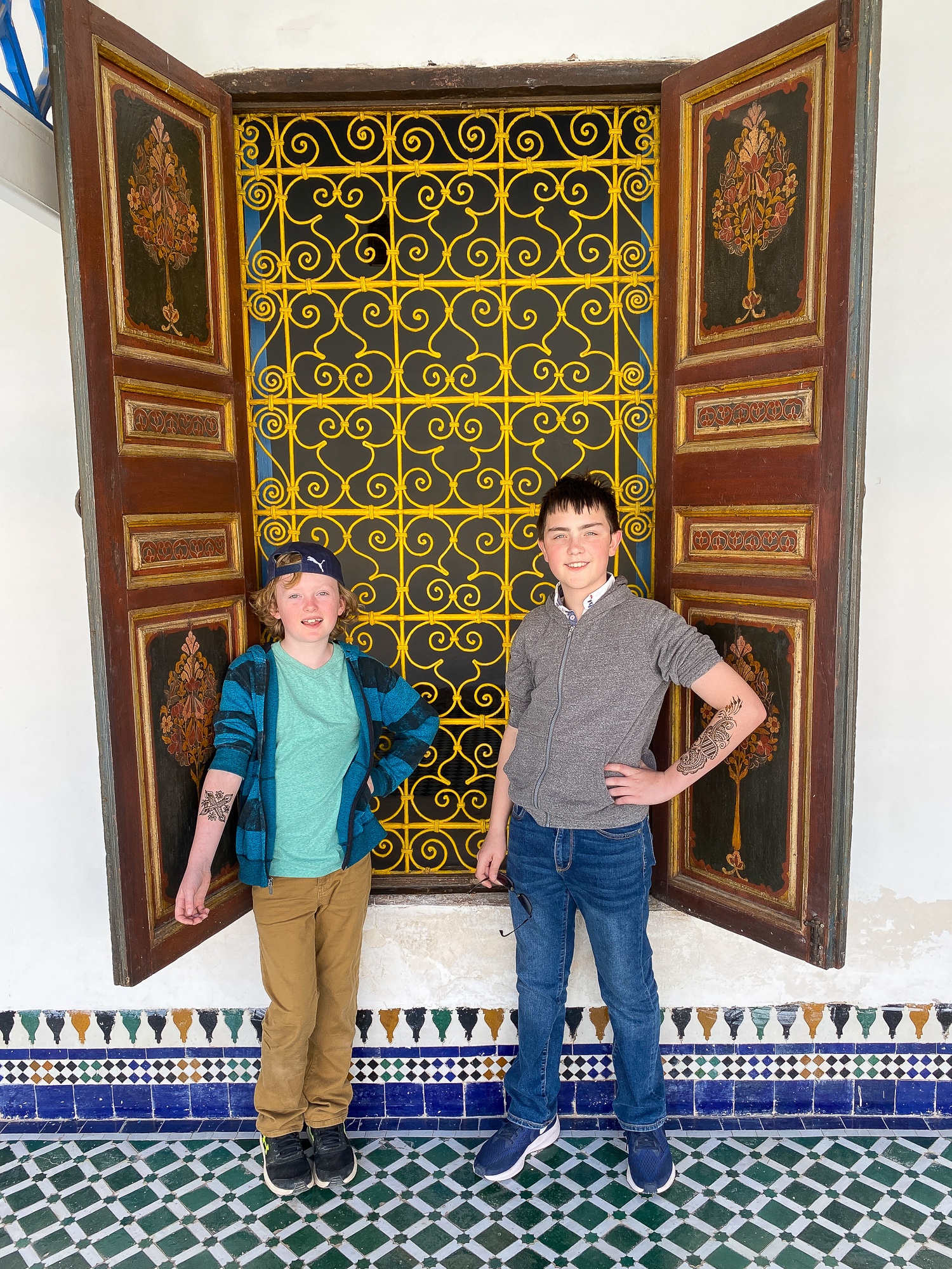 Young boys showing off their henna tattoos at Bahia Palace