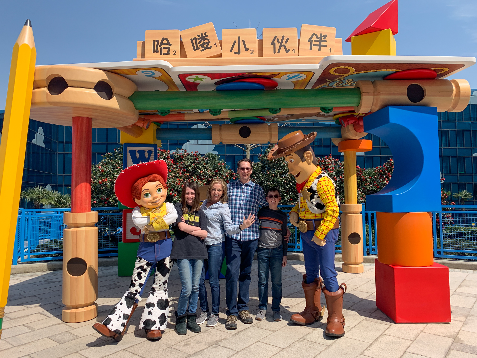 Family with Woody and Jessie at the Toy Story Hotel