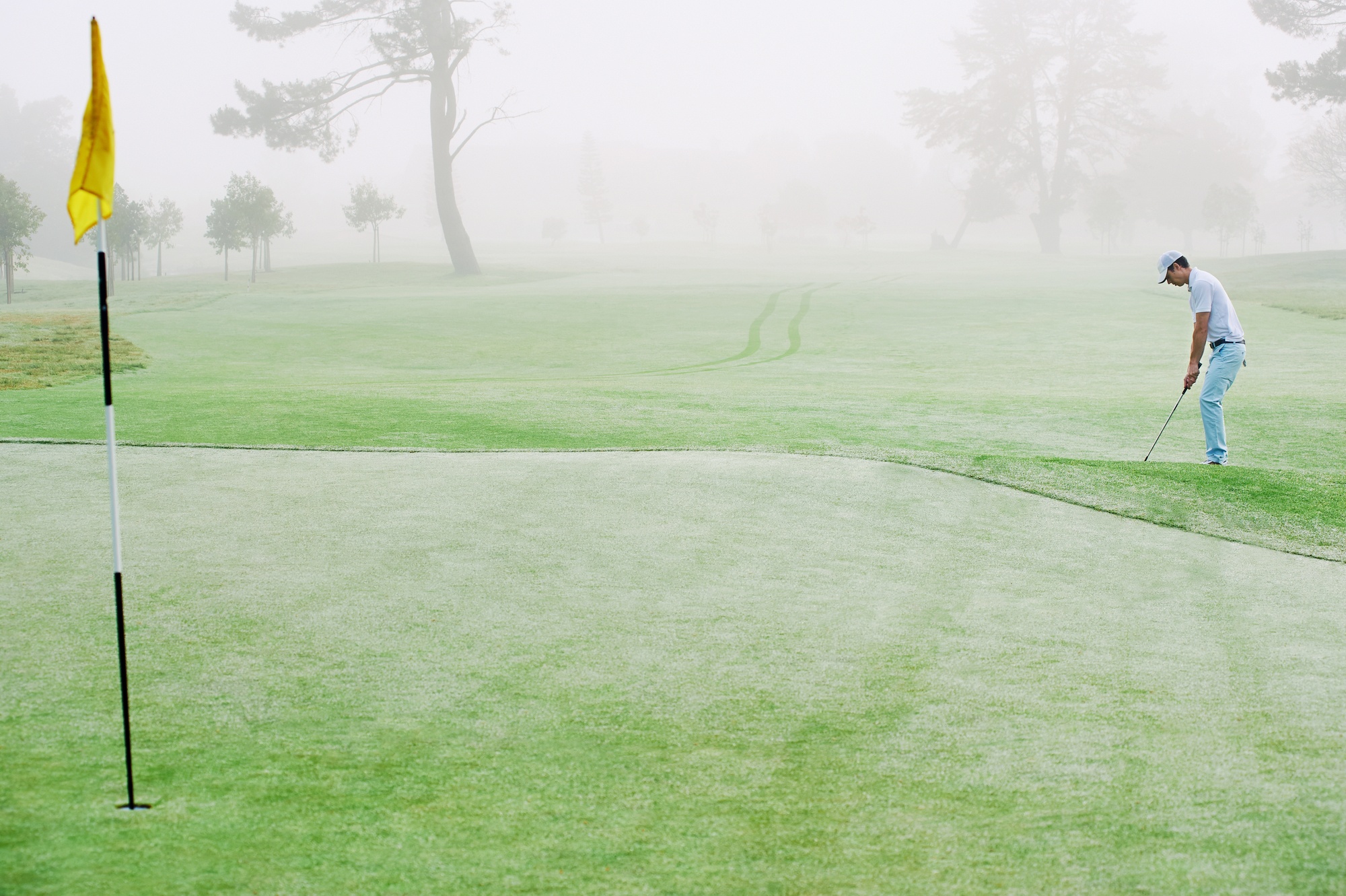 man playing golf solo