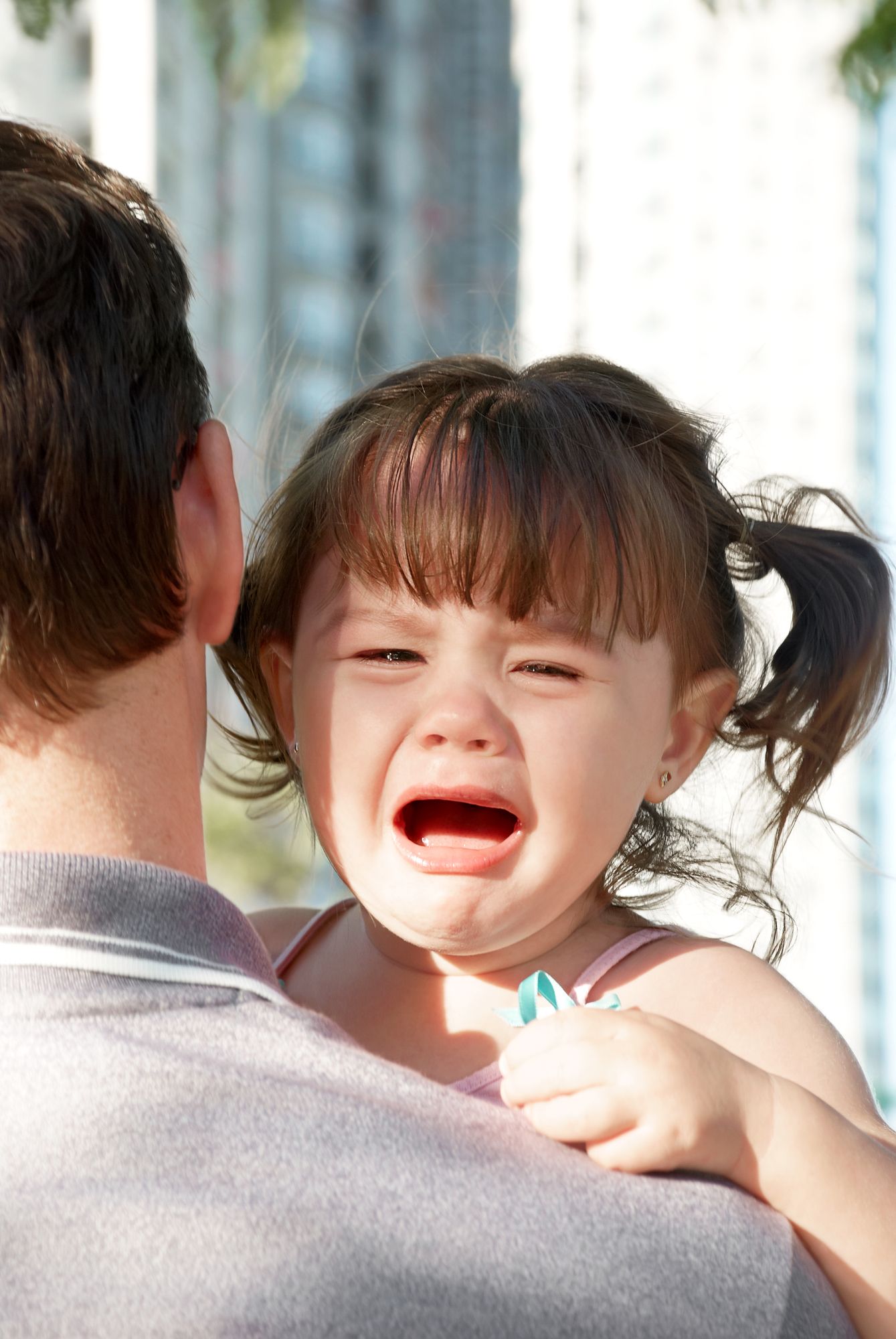 This dad's hands are full. And he knows it. You don't need to tell him. 