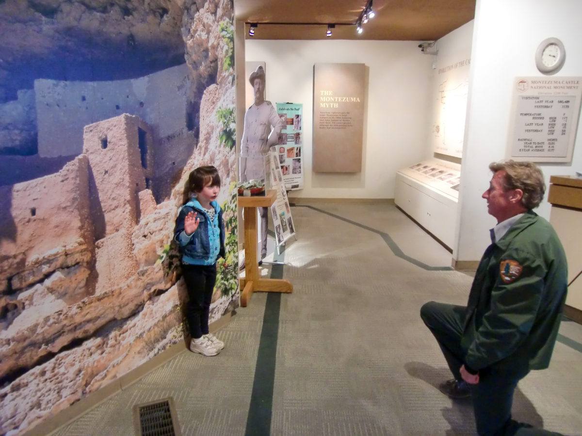 Little girl getting sworn-in for her Junior Ranger badge at Montezuma Castle National Monument in Arizona