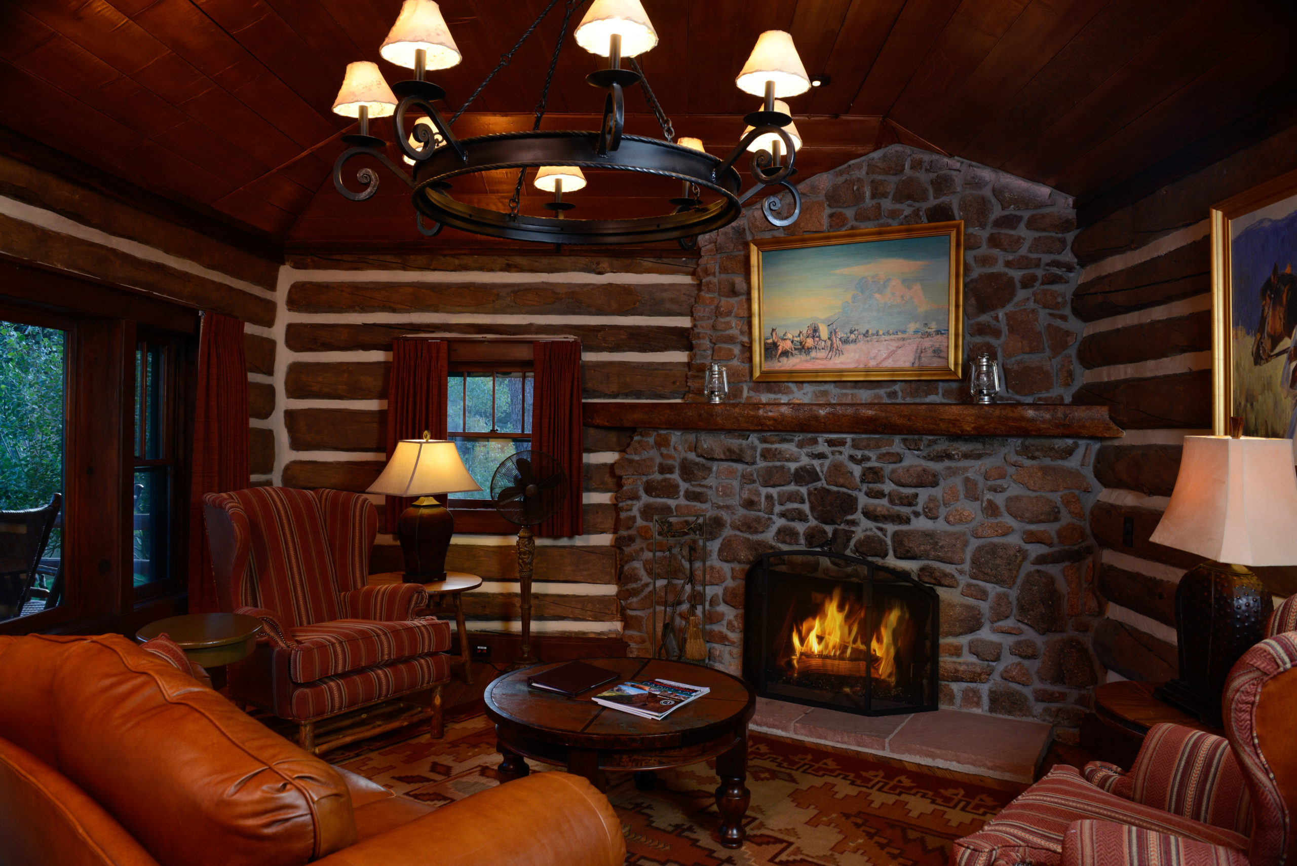 Copper Cabin living area with fireplace at Broadmoor Ranch