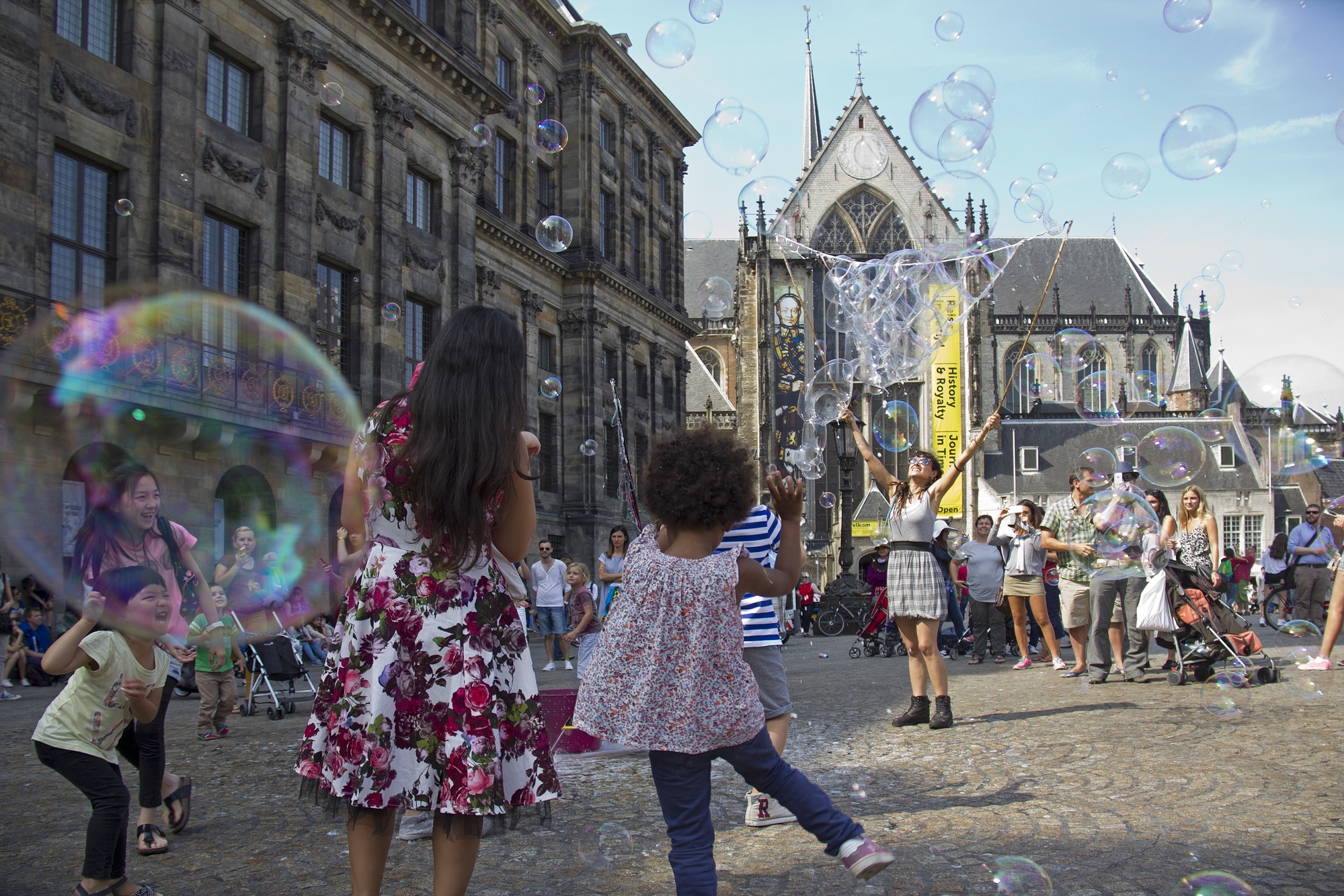 Kids dancing in Dam Square in Amsterdam