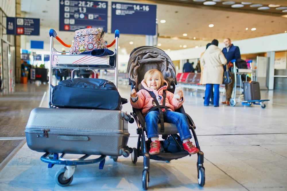 Toddler and luggage in airport